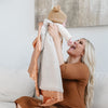 Receiving blanket with a gentle, plush front and a satin back, providing a cozy and elegant wrap for your little one.