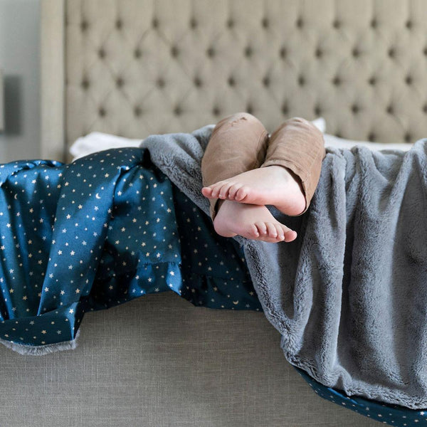 Toddler blanket with a soft, cuddly front and a satin back, offering comfort and elegance for your little one.