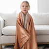 Cozy and soft orange patterned toddler blanket with a satin back, ideal for keeping your little one warm and comforted.