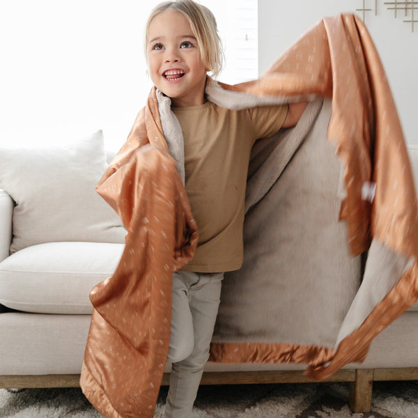 Warm and snuggly toddler blanket with a satin back, providing a soft, comforting layer for your little one.