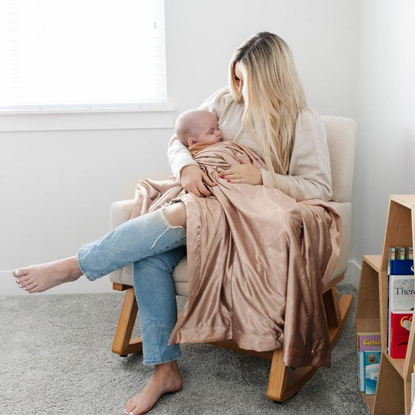 Perfectly cozy pink toddler blanket with a warm, plush front and a sleek satin back, combining comfort with a luxurious feel.