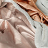 Luxurious satin-backed toddler blankets, offering a soft, comforting embrace with a smooth, elegant touch.