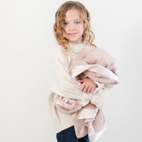 Elegant toddler blanket featuring a soft, cushioned front and a satin back, perfect for keeping your child warm and comfortable with the perfect touch of refined luxury.