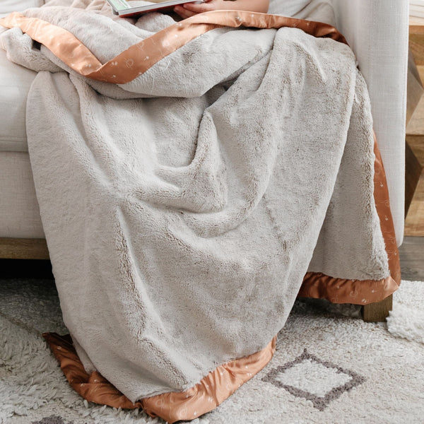 Warm and snuggly Saranoni toddler blanket, featuring a silky-soft texture that cradles your child in gentle luxury.