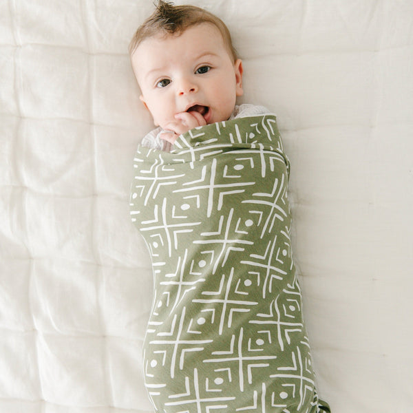 Newborn baby boy wrapped in cozy, soft, STRETCHY SWADDLE - Saranoni