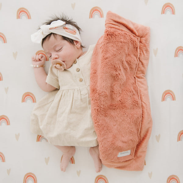 Baby girl laying on rainbow STRETCHY SWADDLES with Lush mini blanket and matching bow headband - Saranoni