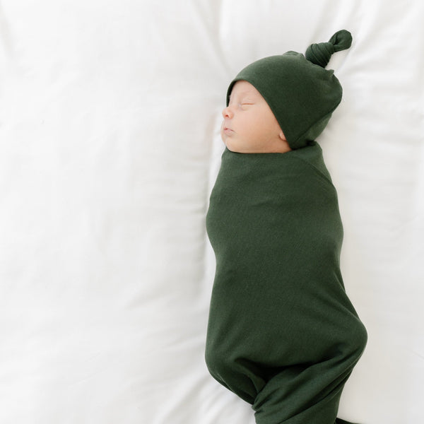 Baby boy peacefuly sleeping in adorable green super soft STRETCHY SWADDLES - Saranoni