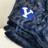 A Luxury Throw Midnight (dark blue) Colored Patterned Faux Fur Saranoni Blanket. The soft blanket is a throw blanket and has a soft faux fur feeling. The blanket has a Brigham Young University Logo.