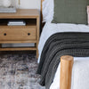 Deep green king-sized blanket featuring a modern waffle knit weave for a chic, textured look.