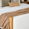 Elegant tan, king waffle knit blanket featuring a classic, grid-like weave, perfect for snuggling..