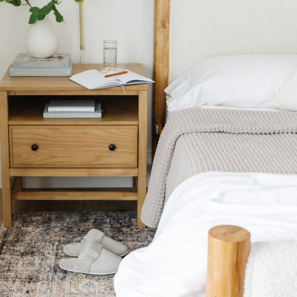 A cozy bedroom shot capturing the cozy essence of a waffle knit blanket. 