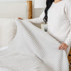 Elegant and cozy king-sized waffle knit blanket, featuring a dense, textured pattern that adds depth and warmth to your bedroom decor.