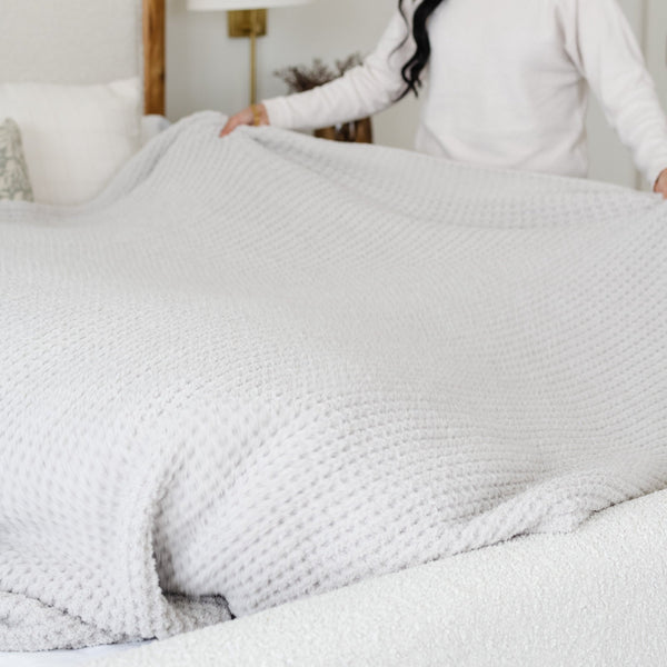 Elegant and cozy king-sized waffle knit blanket, featuring a dense, textured pattern that adds depth and warmth to your bedroom decor.