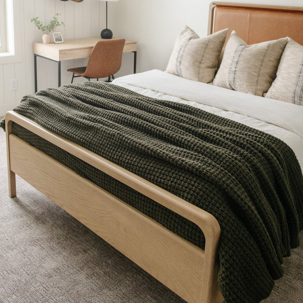 Cozy queen-size waffle knit blanket, perfect for layering on your bed.