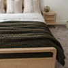 Cozy queen-size waffle knit blanket, perfect for layering on your bed.