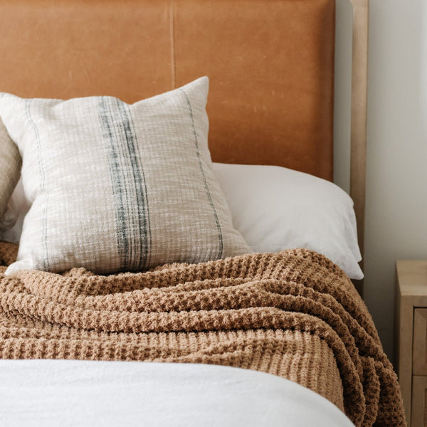 Cozy queen-size waffle knit blanket, perfect for layering on your bed.