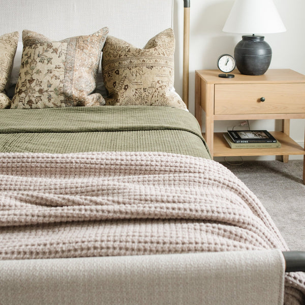 Elegant beige queen waffle knit blanket with a modern, grid-like texture.