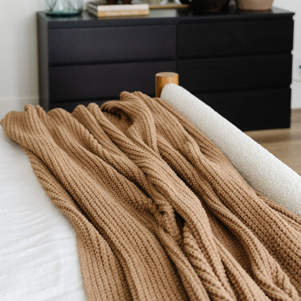 Durable queen-sized blanket with a waffle knit weave for a cozy, modern look.