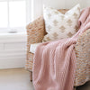 Rosette Waffle Knit Toddler blanket on chair in corner of little girl's bedroom