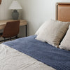 Blue-colored twin waffle knit blanket with a breathable, textured surface for added warmth.